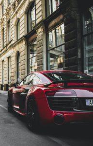 red-and-black-audi-r8-coupe-parked-near-gray-concrete-1545743-192x300.jpg